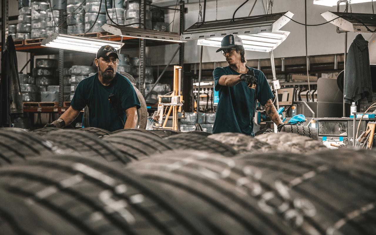 employees pointing tires